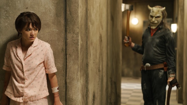 (from left) Gwen (Madeleine McGraw) and The Grabber (Ethan Hawke) in Black Phone 2, directed by Scott Derrickson.