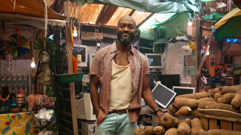 Inua Ellams in a Nigerian-styled street market for Doctor Who series 15