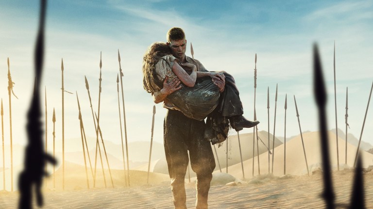 Rand carries Moiraine through the desert in The Wheel of Time