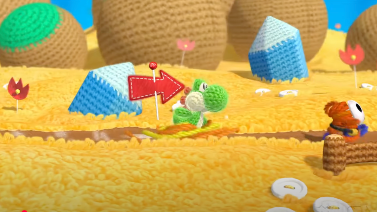 An image from the Wii U game Yoshi's Woolly World in which a wool Yoshi approaches a ShyGuy